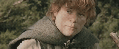 Redhead Boy Holding Flower In Woods GIF