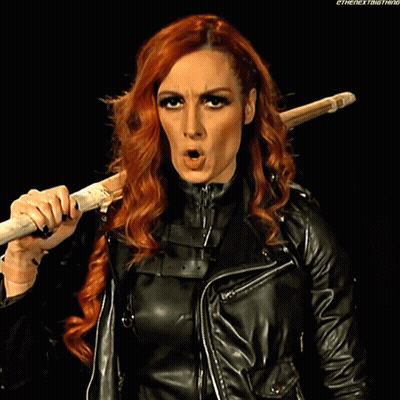 Redhead Holding Stick Over Shoulder Making Funny Face GIF