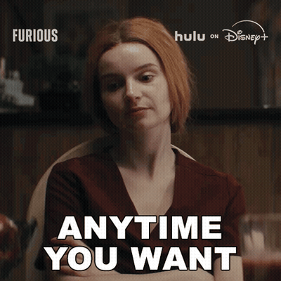 Redhead Saying Anytime You Want Sitting GIF