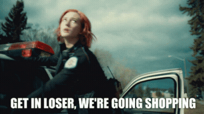 Redhead Standing Next To Police Car Saying Get In Loser We're Going Shopping GIF