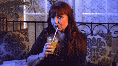 Redhead Woman Drinking Through Straw GIF