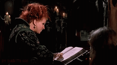 Redhead Woman Holding Book Making Funny Face GIF