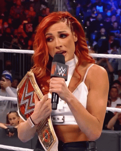 Redhead Woman Holding Wrestling Belt With W Mic GIF