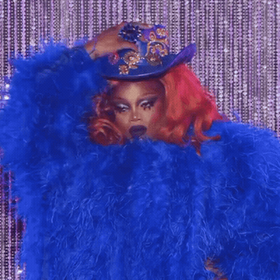 Redhead Woman In Blue Fur Coat And Cowboy Hat GIF