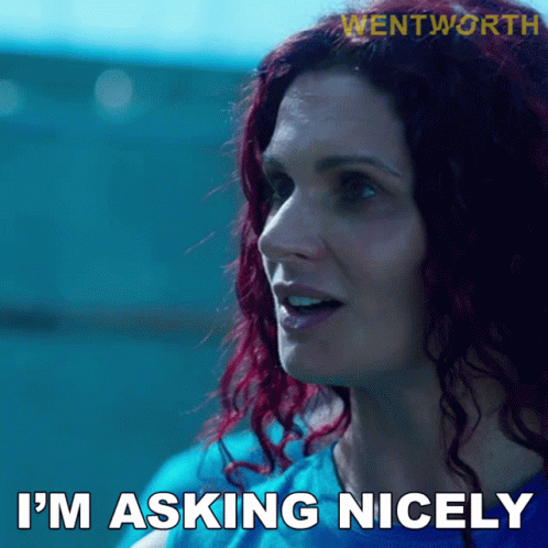 Redhead Woman in Blue Shirt Saying I'm Asking Nicely