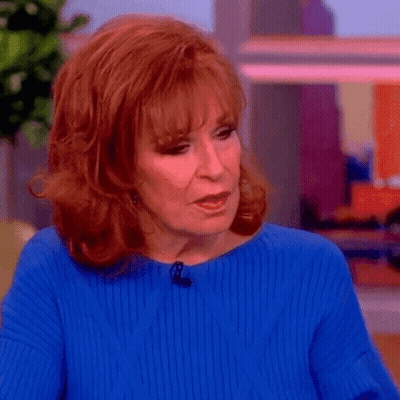 Redhead Woman In Blue Sweater And Earrings GIF