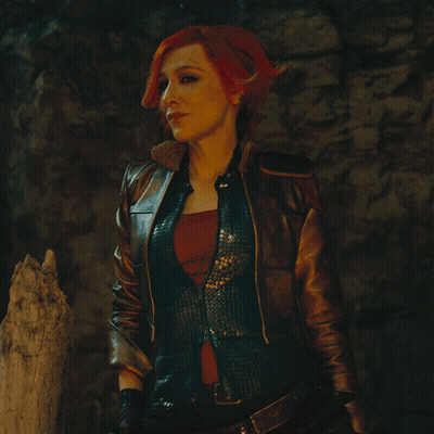 Redhead Woman In Leather Jacket And Vest GIF