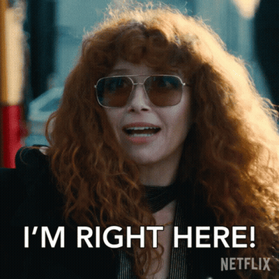Redhead Woman In Sunglasses Saying I'm Right Here GIF