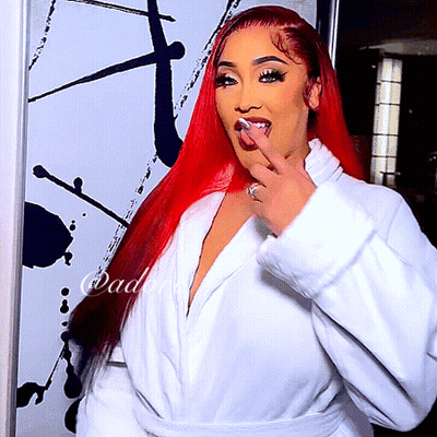Redhead Woman In White Robe With Ring GIF