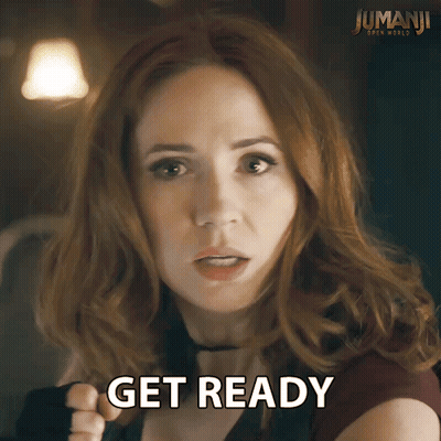 Redhead Woman Says Get Ready In Front Of Jumanji Poster GIF