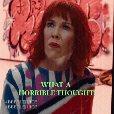 Redhead Woman Says What A Horrible Thought In Front Of Graffiti GIF