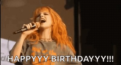 Redhead Woman Singing Happy Birthday Into Microphone GIF