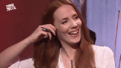 Redhead Woman Smiling Holding Pen GIF