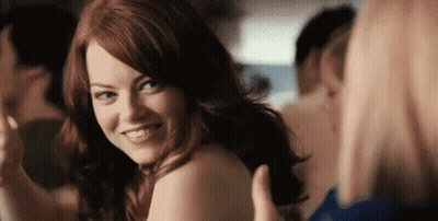 Redhead Woman Smiling Over Her Shoulder GIF
