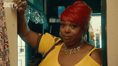 Redhead Woman Standing In Doorway With Bet On Wall GIF