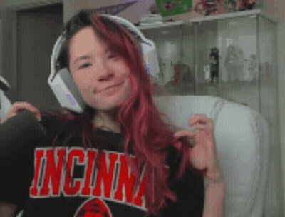 Redhead Woman Wearing Headphones and Cincinnati Shirt