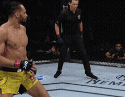 Referee Behind Boxer In Ring GIF
