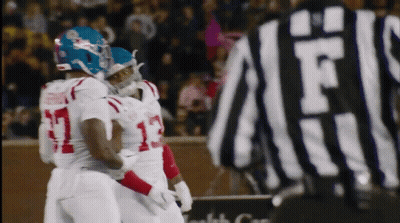Referee Behind Football Player Number 13 GIF
