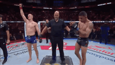 Referee Between Two Boxers In Ring GIF