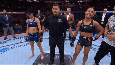Referee Between Two Women In UFC Outfits GIF