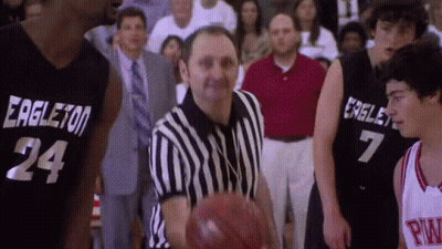 Referee Holding Basketball In Front Of Two Players GIF