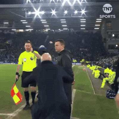 Referee Holding Red And Yellow Flag At TNT Sports Sign GIF
