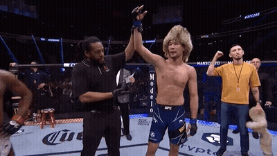 Referee Holding Up Fighter Hand In UFC Ring GIF
