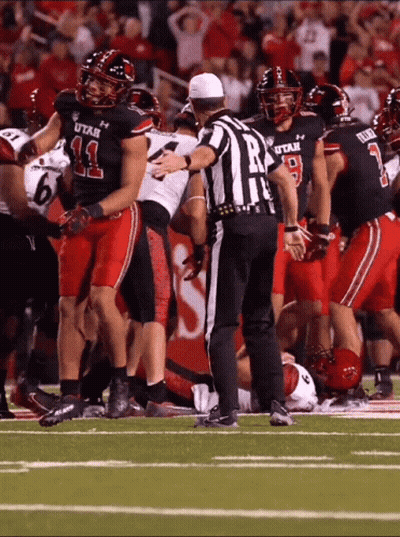 Referee In Front Of Utah Football Players GIF