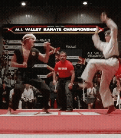 Referee In Red Shirt Watching Karate Match GIF