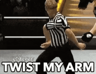 Referee In Wrestling Ring Saying Twist My Arm GIF