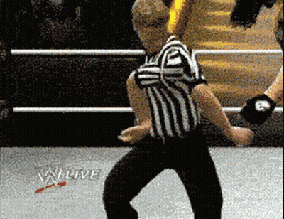 Referee In Wrestling Ring With Live Text GIF