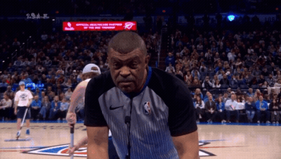 Referee On Basketball Court In Front Of Crowd GIF