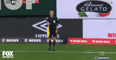 Referee On Soccer Field With Bruno Gelato Sign GIF