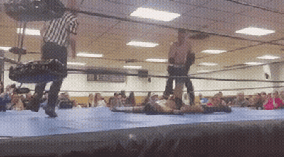 Referee Standing Over Wrestler GIF
