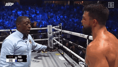 Referee Talking To Boxer In Ring GIF
