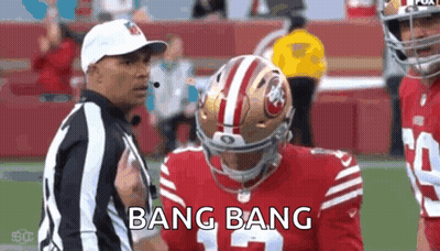 Referee Talking To Football Player On Field GIF