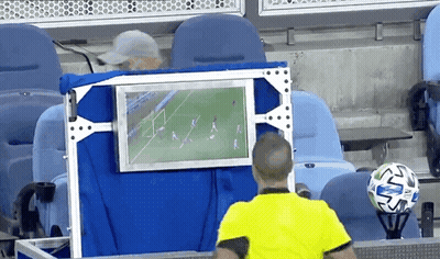 Referee Watching Soccer Game On Monitor GIF