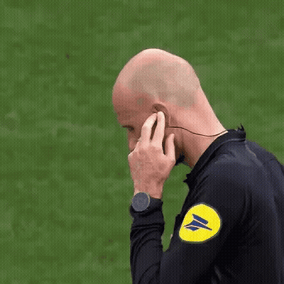 Referee Wearing Earbuds GIF