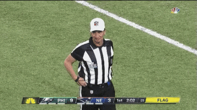 Referee With Flag Scoreboard On Football Field GIF