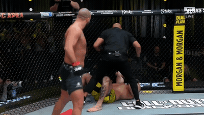 Referee With Morgan & Morgan Sign GIF