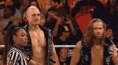 Referee With W Logo Between Two Wrestlers GIF