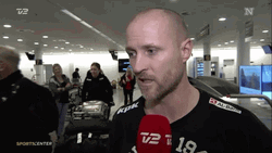 Reporter Interviewing Handball Player