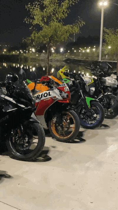 Repsol Motorcycles Parked At Night GIF