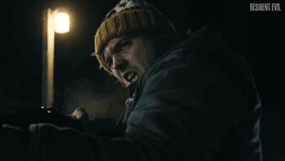 Resident Evil Poster Man Holding Gun GIF