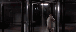 Revolving Door Patrick Bateman American Psycho GIF
