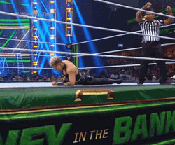 Rhea Ripley Bangs Head Against Wall GIF