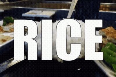 Rice Is Being Poured Into A Glass With Chopsticks GIF