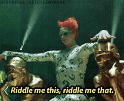Riddle Me This Riddle Me That Is Written In Yellow Letters GIF