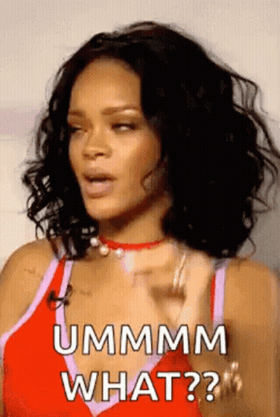 Rihanna Is Wearing A Red Tank Top And A Choker And Is Asking What . GIF