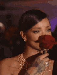Rihanna Kissing A Rose
